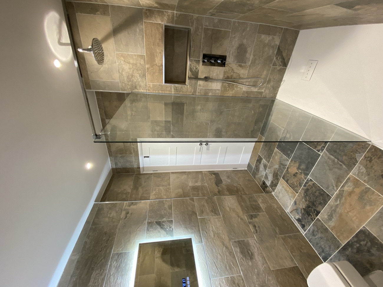 Slate-tiled wet room with walk-in shower